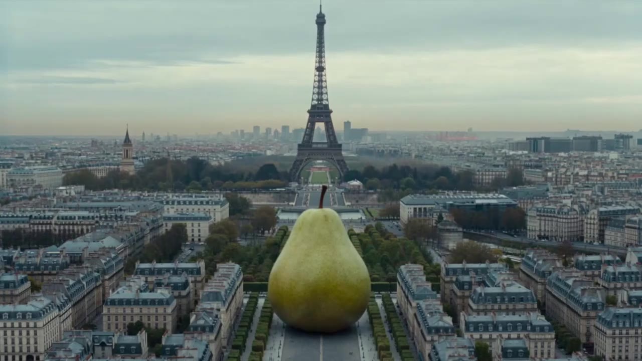 AI video of a giant pear in front of the Eiffel Tower