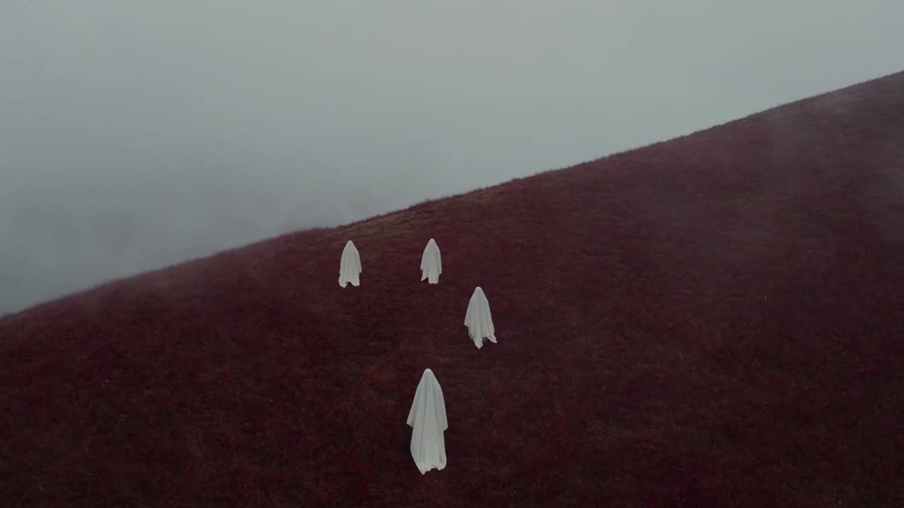 AI video of a white ghost figure standing on a red hillside